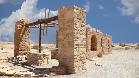Quseir (Qasr) Amra desert castle near Amman, against the background of moving clouds, Jordan. World heritage with famous fresco's. 