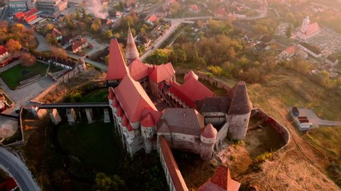 Famous attraction gothic Corvin Castle in Hunedoara Transylvania, Romania in autumn - aerial view from above