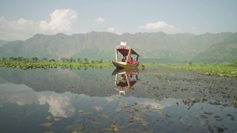 Kashmir / India - 04 15 2018: People Riding The Traditional Shikara Boat In Dal Lake