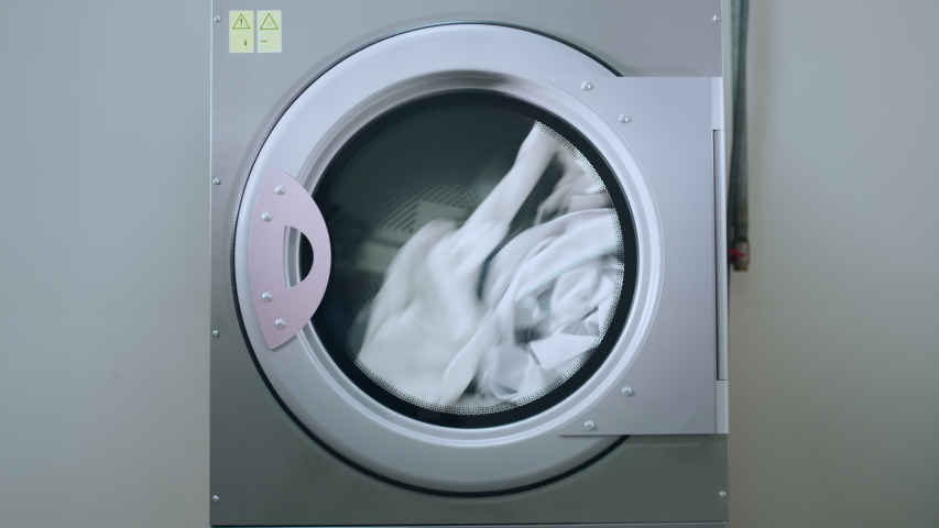 Industrial washing machine washing clothes laundry machine working industrial machine washing clothing laundry washing machine industry laundry service | Shutterstock HD Video #1056536381