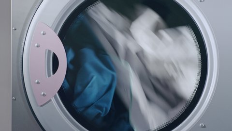 Industrial dryer machine working closeup of drying clothes in drying machine close up of dryer machine dry clothes close up of drying laundry machine drying clothes laundry
