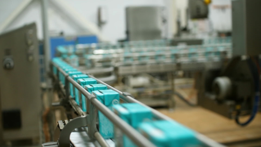Dairy products factory. Cartons of milk. Conveyor for milk packaging. | Shutterstock HD Video #1056546755
