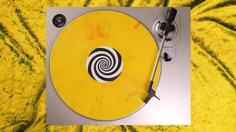 Yellow, green & red splatter 12” vinyl record on a DJ turntable with yellow velvet background. Circular long player shot from above. Party, disco, rock, grunge, pop, house music. 60s, 70s, 80s, 90s 4K
