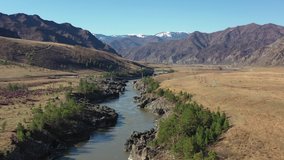 Aerial video from drone with flight along Katun river  with view on Oroktoi bridge and Teldykpen rapids. Altai, Siberia, Russia