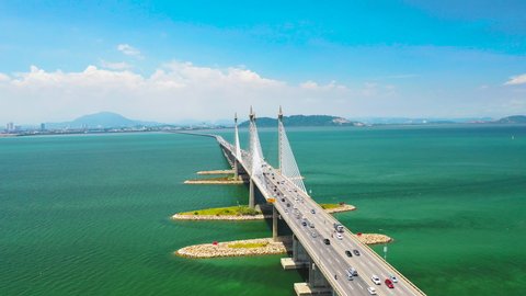 Aerial Orbiting Of Penang Bridge Malaysia With Beautiful Sky And Turquoise Water 4K Drone Cinematic Footage