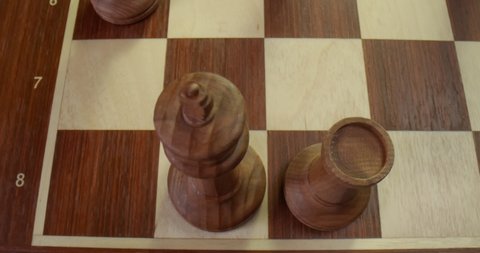 Close up top view of player making castling move protecting king playing wooden chess. Grandmaster moving white king and rook during tournament.