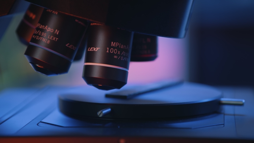 Lext Headquaters: Shinjuku, Tokyo, Japan. Close up image of microscope in laboratory. Scientist using hi-tech microscope examining sample in industrial lab Royalty-Free Stock Footage #1056569222
