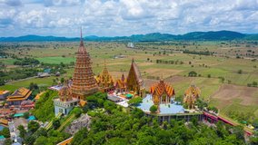 aerial view hyper lapse 4k video of  Tiger Cave Temple (Wat Tham Suea) is one of the most interesting and beautiful temples of Thailand, and by far the most beautiful in Kanchanaburi province.