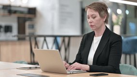  Businesswoman doing Video Call on Laptop in Office 