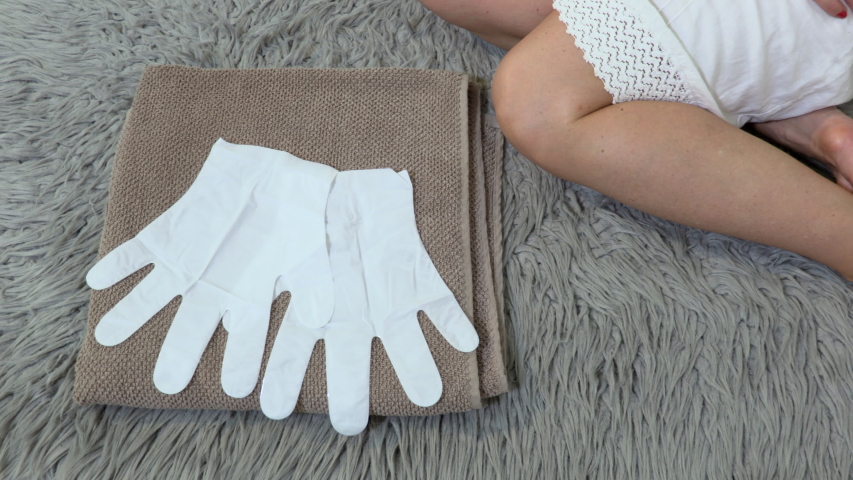  Spa gloves for dry hands on towel
