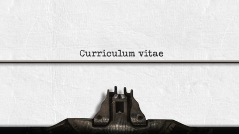 Animation of a close up of the type guard and moving type bars of a typewriter, typing out the words Curriculum vitae in upper and lower case letters on plain white paper