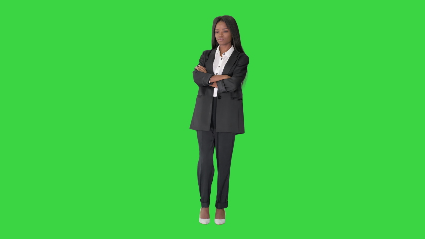 Nice attractive lovely pretty cute girl with folded arms on a Green Screen, Chroma Key. | Shutterstock HD Video #1056592604