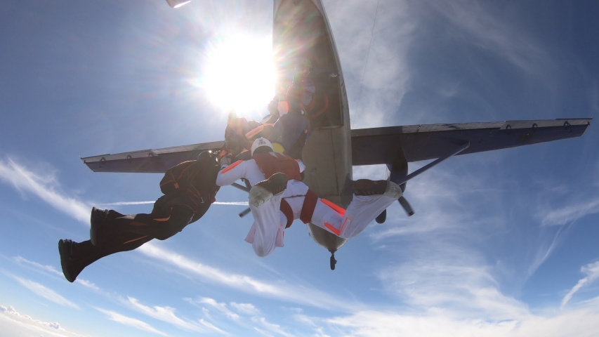 Formation skydiving. A group of skydivers is training in the sky. Royalty-Free Stock Footage #1056595721