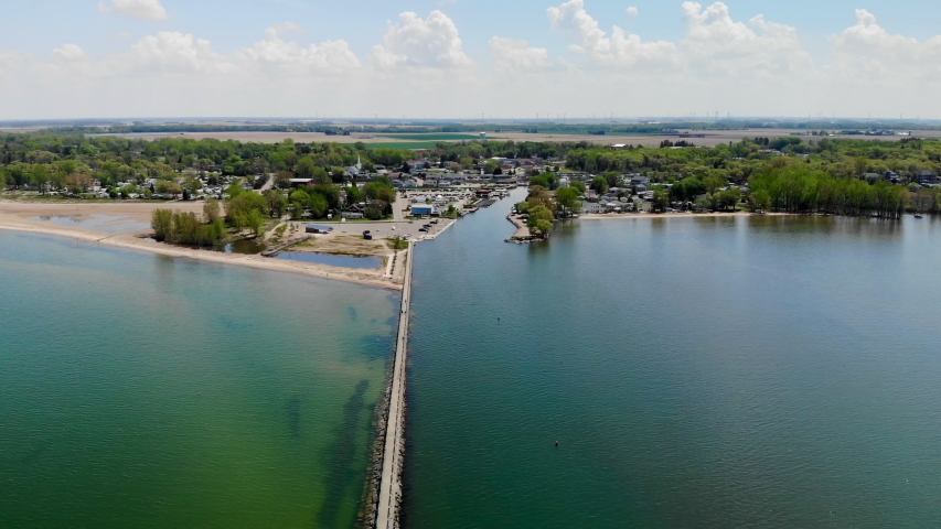 Aerial footage over Lake Huron approaching small rural town of Caseville, Michigan