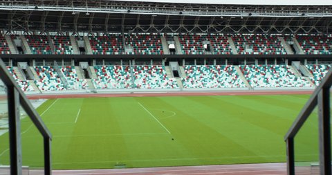 WIDE View of empty stadium seats before game or during Coronavirus COVID-19 pandemic. Shot on RED cinema camera with Anamorphic lens