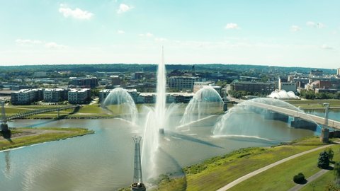
Drone circling river fountain revealing downtown Dayton skyline