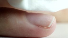degreasing nails with a manicure wipes, closeup, fingernail