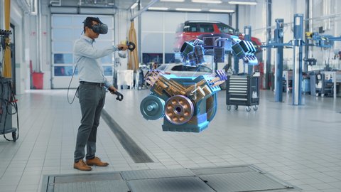 Car Service Manager Uses a Futuristic Virtual Reality Headset Diagnostics Gadget with Controllers. Specialist Inspecting the V6 Internal Combustion Engine for Parts and Component Numbers.