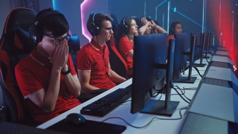 Two Esport Teams of Pro Gamers Play in Mock-up FPS Shooter Video Game and Loses on a Championship. Cyber Games Arena Online Broadcasting Tournament. Arc Shot Slow Motion