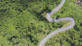 Footage B roll of Aerial view drone flying above landscape serpentine winding road. a car driving in the winding road. Drone 4K Video. road winding on the mountains in summer sunny day.