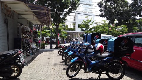 Bandung / Indonesia - Feb 03, 2020: Domino's Pizza Delivery Motorcycle Parking in The Parking Lot