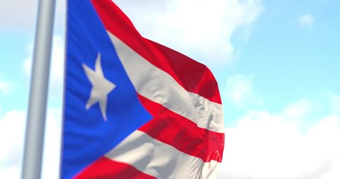 Puerto Rico flag on a flagpole waving in the wind in the sky. Wonderful intro for yor projects. The Commonwealth of Puerto Rico.