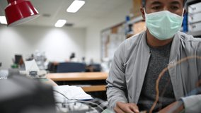 Electronic technician working in the lab - Powered by Shutterstock - Get 15% off with code: PIKWIZARD15