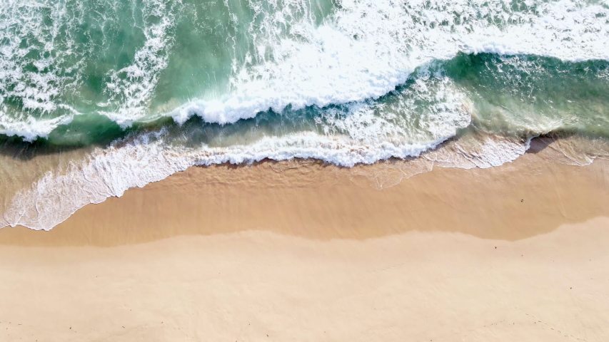 4K UHD Aerial view top view Beautiful topical beach with white sand. Top view empty and clean beach. Beautiful Phuket beach is famous tourist destination at Andaman sea. | Shutterstock HD Video #1056683243