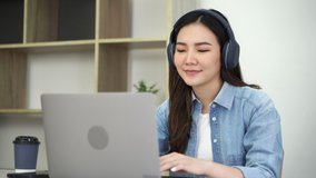 Confident asian young woman online video conference with laptop in her home.