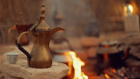 Tea pots and coffee making on a bonfire in Dubai
