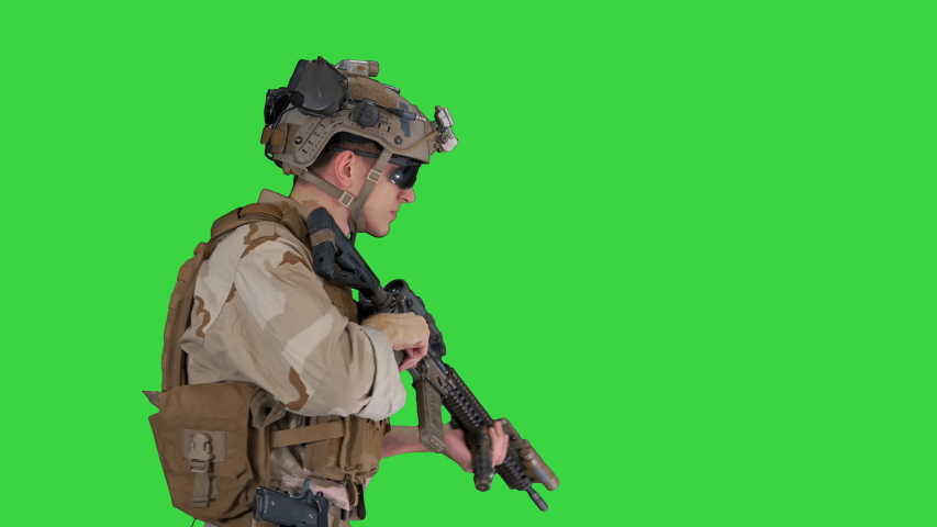Marine walking, aiming and shooting on a Green Screen, Chroma Key.