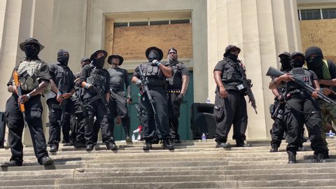 2020 Louisville Kentucky. Grand Master Jay, leader of the NFAC, gives a Speech on the Steeps of Louisville Metro Hall.  The Black Armed Militia provide Armed Protection 