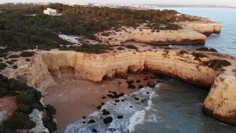 Aerial drone shot of Praia de Benagil beach on Atlantic coast, Algarve, Portugal. High quality 4k footage