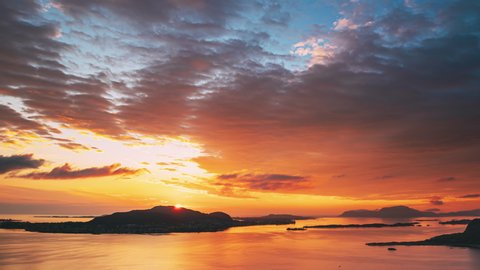 Alesund, Norway. Amazing Natural Bright Dramatic Sky In Warm Colours Above Alesund Valderoya And Islands In Sunset Time. Colorful Sky Background. Beauty In Norwegian Nature. 4K