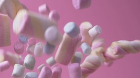 Pile of soft tasty colorful marshmallows falling on pink background. Delicious fluffy chewy snack candie treats. Confectionery. Sweet shop. Close-up. - Powered by Shutterstock - Get 15% off with code: PIKWIZARD15