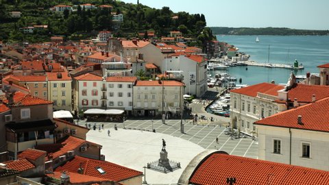 Timelapse of Tartini Trg Square in Piran Slovenia, with and seaside in the background on a Sunny day 