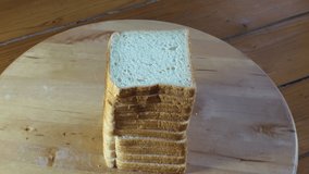 sliced toast bread made of different alternative compositions on wooden board Detail Macro shot 4K video Conceptual bread shoot buying now. 