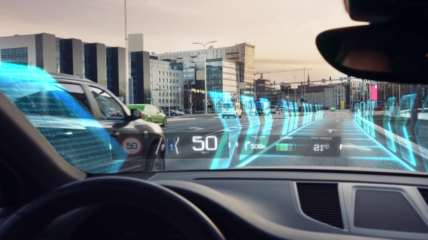 Futuristic Concept:  Autonomous Self-Driving Car Moving Through City, Head-up Display HUD Showing Infographics: Speed, Distance, Navigation. Road Scanning. Driver Seat  POV  First Person View FPV
 | Shutterstock HD Video #1056741539