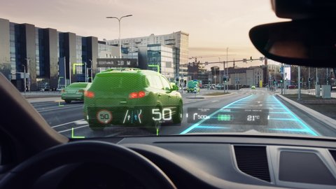 Futuristic Autonomous Self-Driving Car Moving Through City, Head-up Display HUD Showing Infographics: Speed, Distance, Navigation. Road Scanning. Driver Seat Point of View POV  First Person View FPV