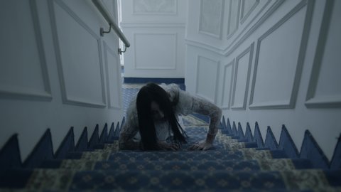 Female zombie climbing upstairs, scary phantom of lady in wedding dress, devil 스톡 비디오