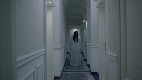 Possessed young woman walking in haunted hotel, paranormal activity, phantom 스톡 비디오