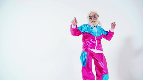  Fashionable grandfather posing with funny futuristic clothes. Senior man portraits on colored background