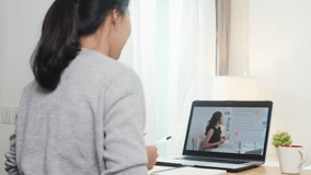 Young Asia teen girl university student using laptop computer distance learn lesson with female teacher remote teaching on internet at home. Social distancing, quarantine for corona virus prevention.
