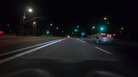 Night driving time lapse view of Topanga Canyon Bl and Route 118 freeway in the area of Los Angeles, California.