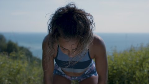 Focus and determination. Powerful woman breathes heavily after extreme workout. Working towards her goals. Shot in 4k. 