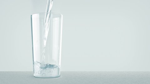 Glass Of Filtered Water Being Poured