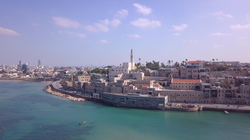 Tel Aviv and Jaffa skyline, aerial view above the old city and port of Jaffa and TLV coastline in the background.