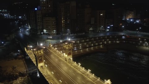 Aerial Drone Night shot over Egypt Alexandria city stanley bridge quarantine time