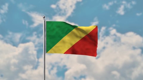 Republic of the Congo flag waving in the blue sky realistic 4k Video.