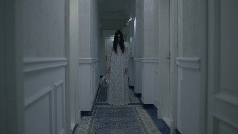 Psycho woman in white dress with toy walking In hotel corridor, creepy nightmare